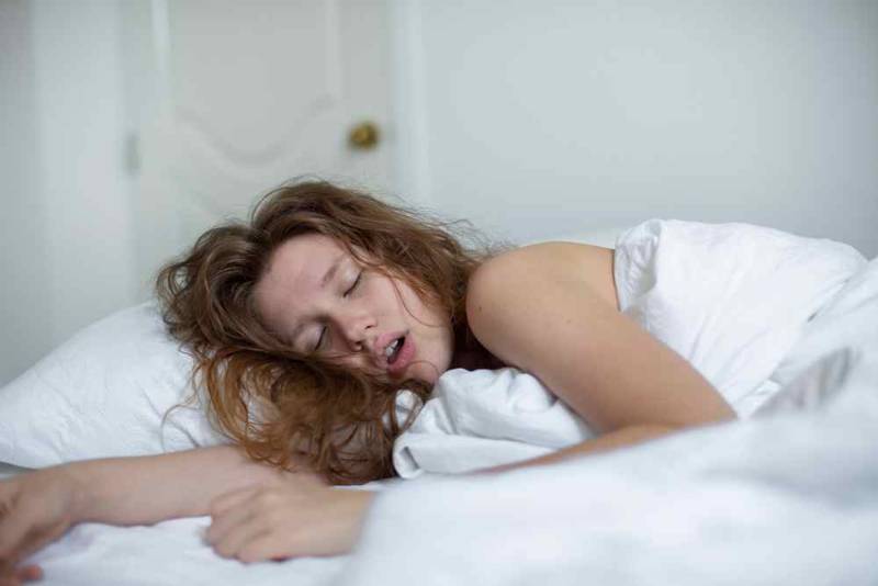 A side-by-side photo showing a female breathing through the mouth during sleep, with visible dry lips and open mouth — illustrating the effects of mouth breathing on oral and overall health
